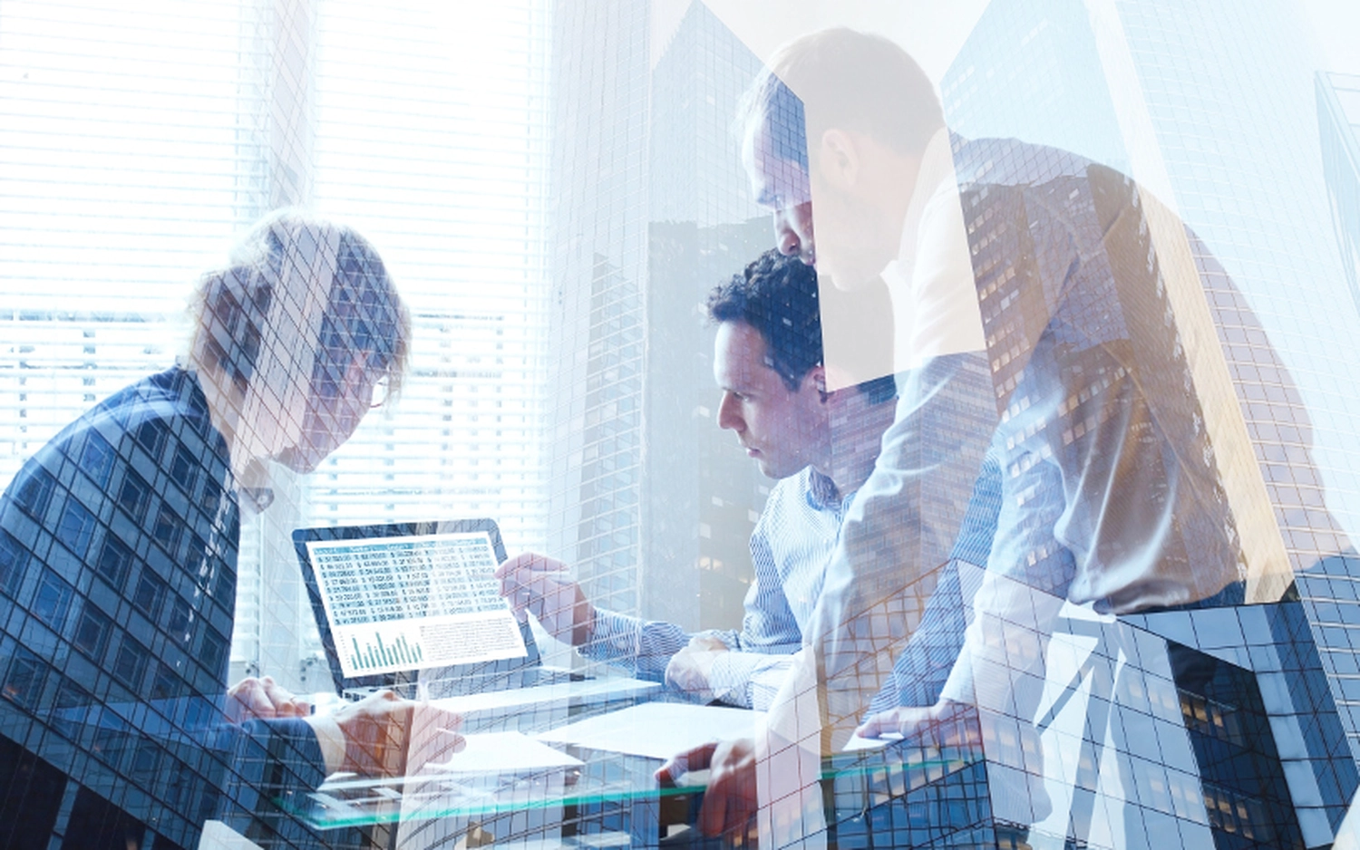 EMshield GmbH - Architecture and Corporate Security - a team of business professionals collaborating in an office environment, likely reviewing financial data, market trends, or startup metrics.